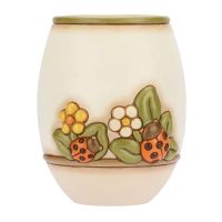 Country vase with flowers and lucky ladybird