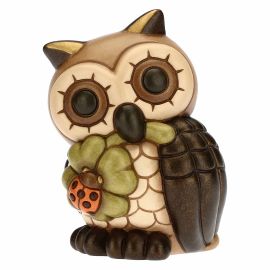 Wise owl with lucky four-leaf clover