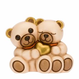 Teddy couple with golden heart