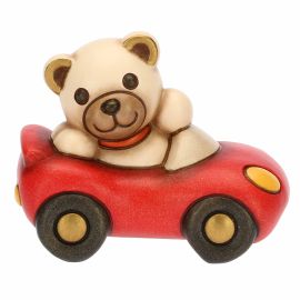 Teddy Motors in a car